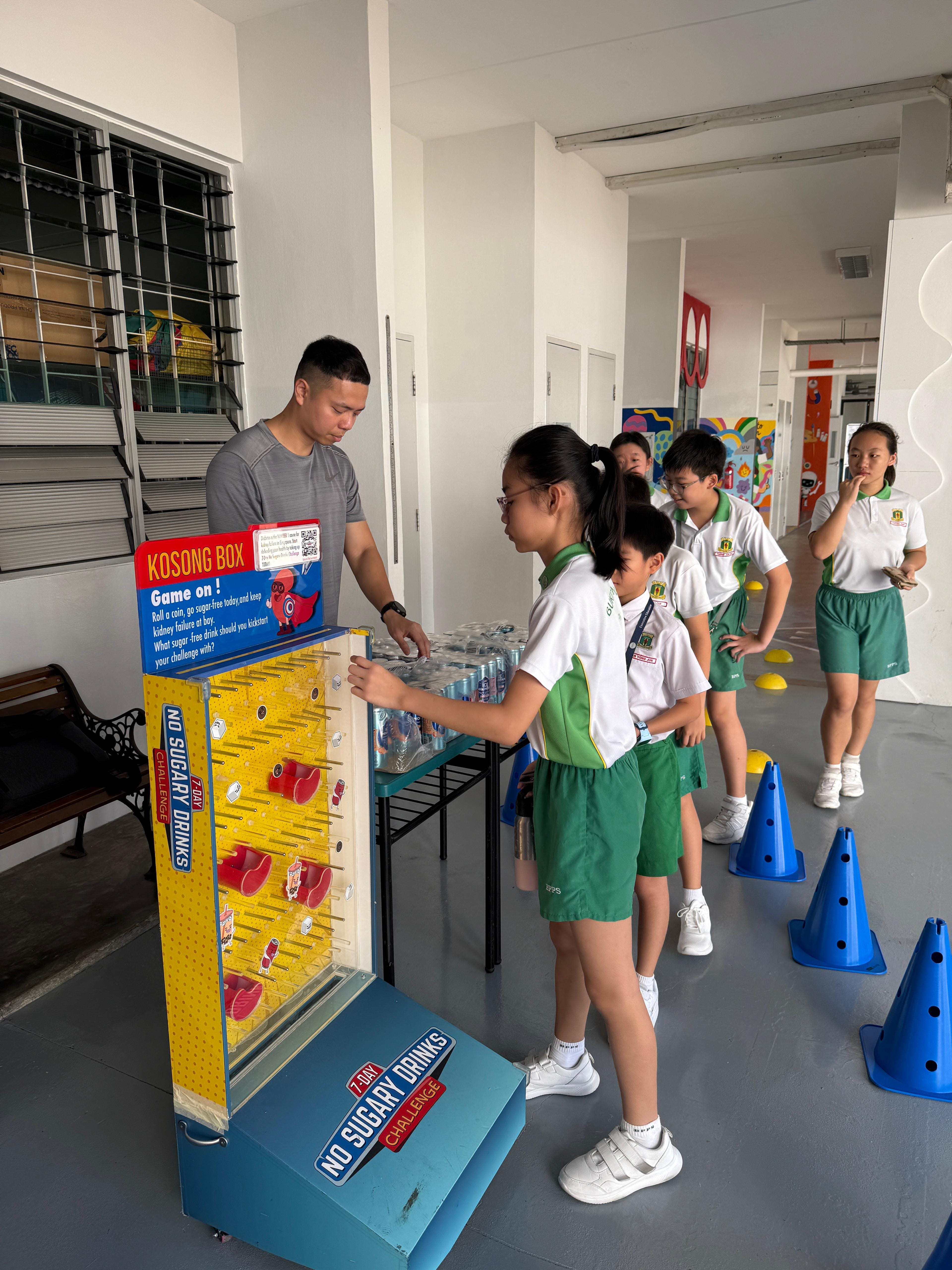Students learning the importance of sugar in their diet through a game
